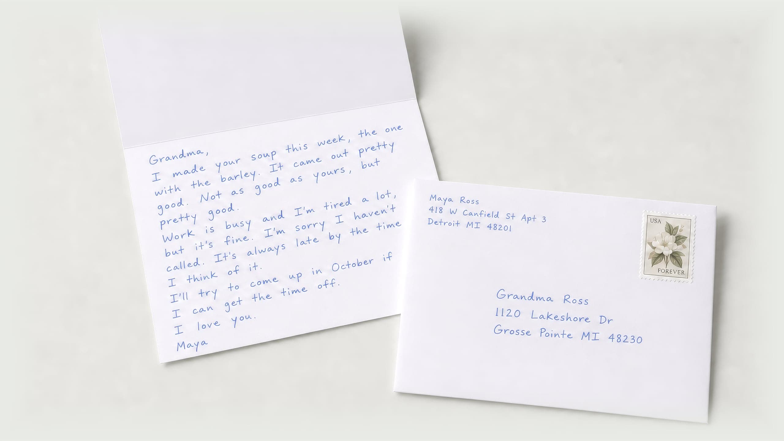 A handwritten note on a folded card, and the stamped envelope it is mailed in, addressed to Grandma